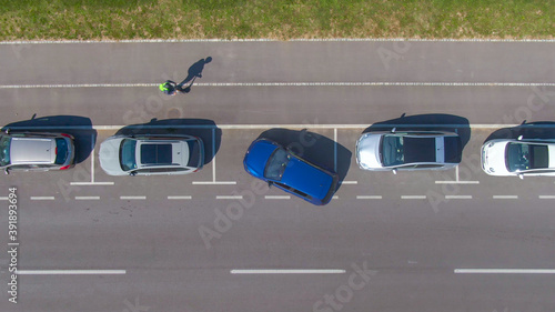 Quadro em tela TOP DOWN: Person tries to parallel park their car into a tight roadside spot