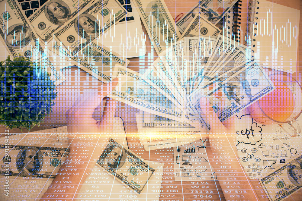 Multi exposure of financial graph drawing hologram and USA dollars bills and man hands. Analysis concept. Multi exposure of financial graph drawing hologram and USA dollars bills and man hands. Analysis concept.