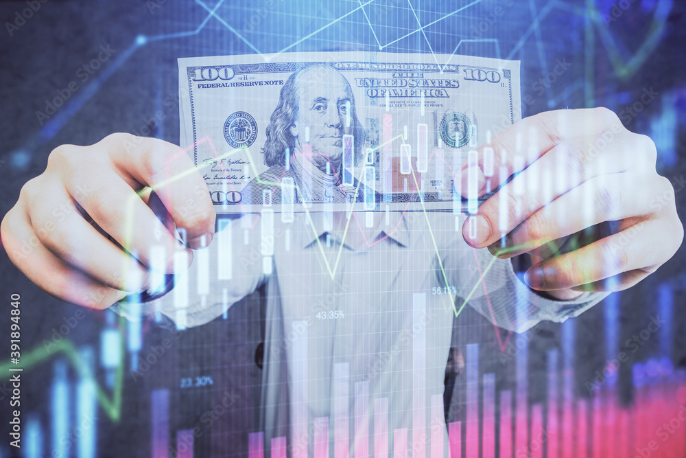 Multi exposure of financial graph drawing hologram and USA dollars bills and man hands. Analysis concept. Multi exposure of financial graph drawing hologram and USA dollars bills and man hands. Analysis concept.