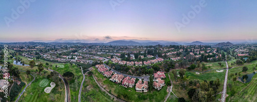 Aerial panoramic view of golf in upscale residential neighborhood during sunset, Rancho Bernardo, San Diego County, California. USA. 