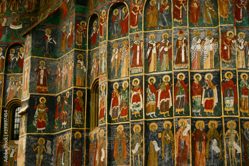 The painted medieval church in Romania. On the outer wall of Sucevita Monastery  various biblical scenes are painted