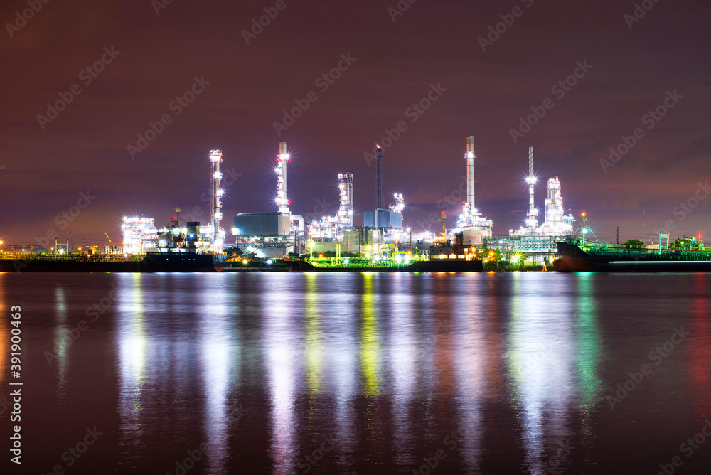 Oil refinery industry at sunset - factory - petrochemical plant