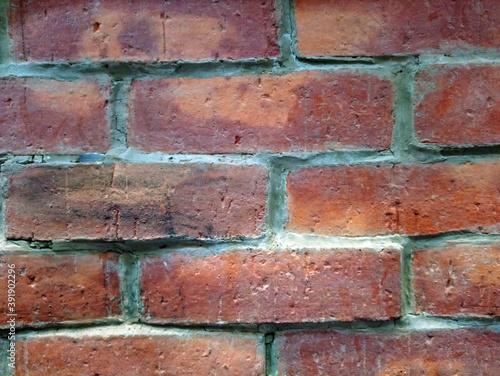 Brown bricks stack layer wall cladding background