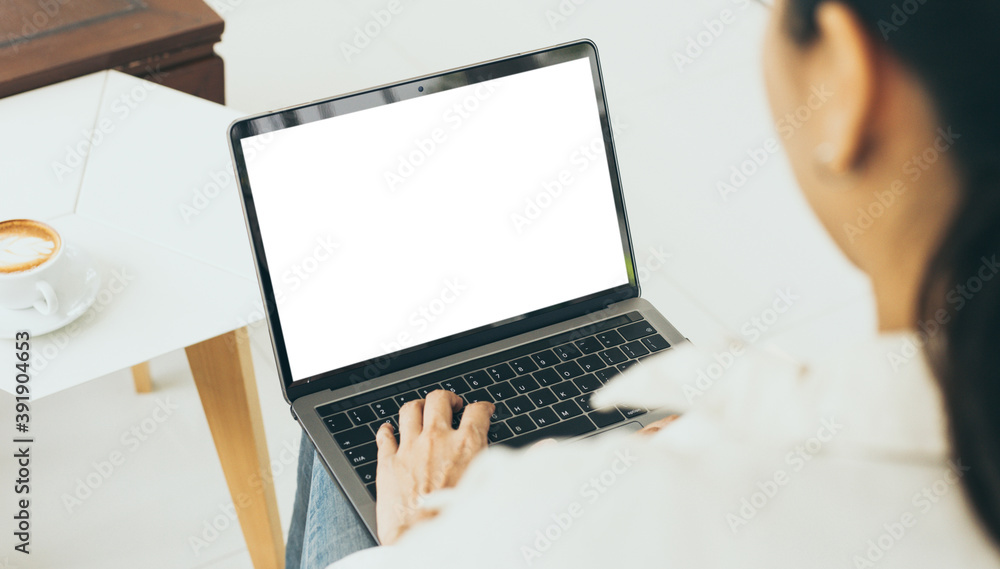 computer blank screen mockup.hand woman work using laptop with white background for advertising,contact business search information on desk at coffee shop.marketing and creative design computer blank screen mockup.hand woman work using laptop with white background for advertising,contact business search information on desk at coffee shop.marketing and creative design