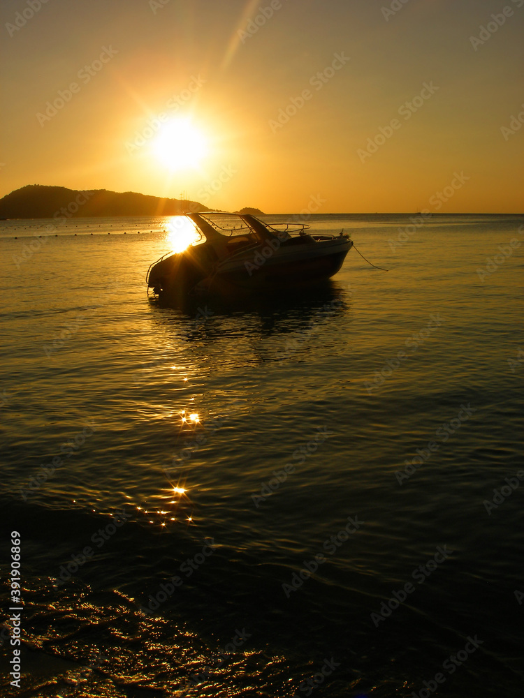 Reflection of Single Boat with Burning Sky During Sunrise/Sunset ,  Orange suface water flow flare