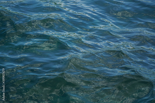 Crystal clear sea water ripples in Nusa Penida.