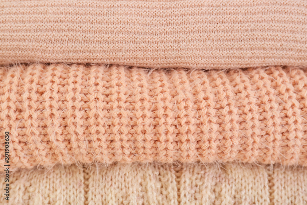 Stack of warm winter clothes as background
