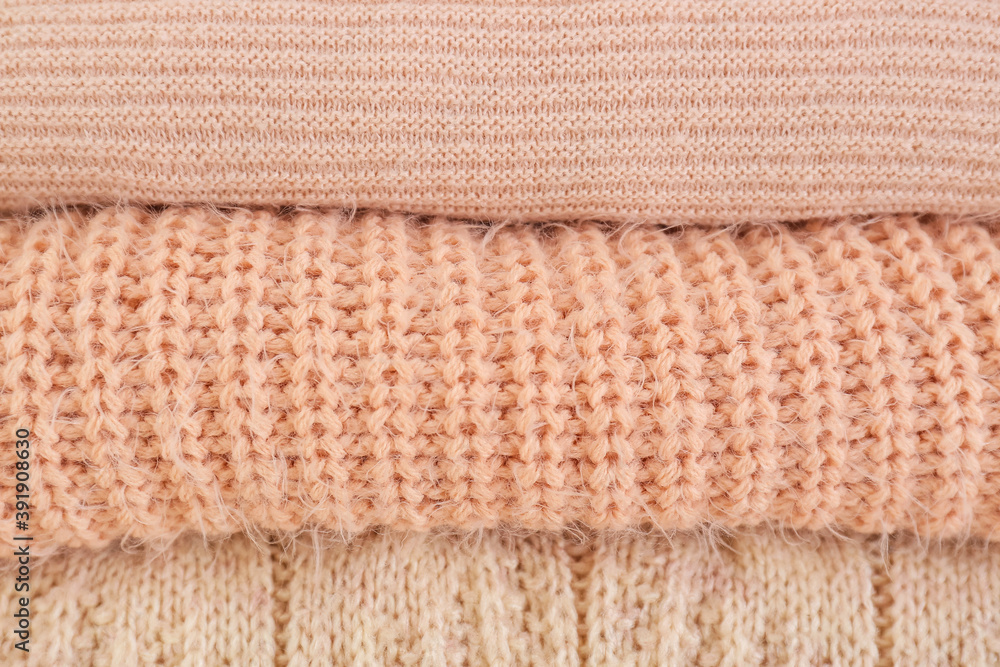 Stack of warm winter clothes as background Stack of warm winter clothes as background