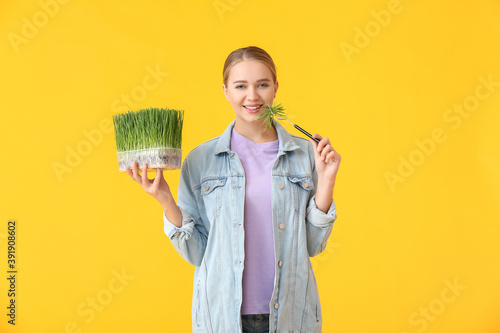 Young woman with wheatgrass...