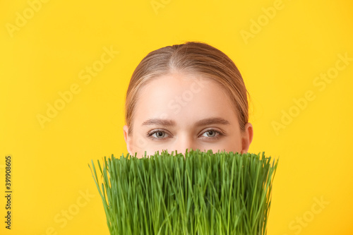 Young woman with wheatgrass...