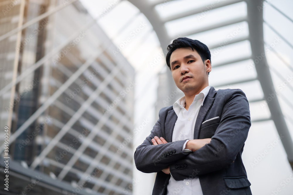 business man with arcs crossed and thinking in the city business man with arcs crossed and thinking in the city