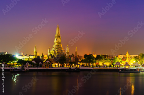 Wat Arun with Chao Phraya river at sunrise in Bangkok, Thailand © geargodz