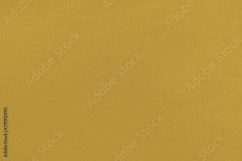 Mustard homogeneous background with a textured surface