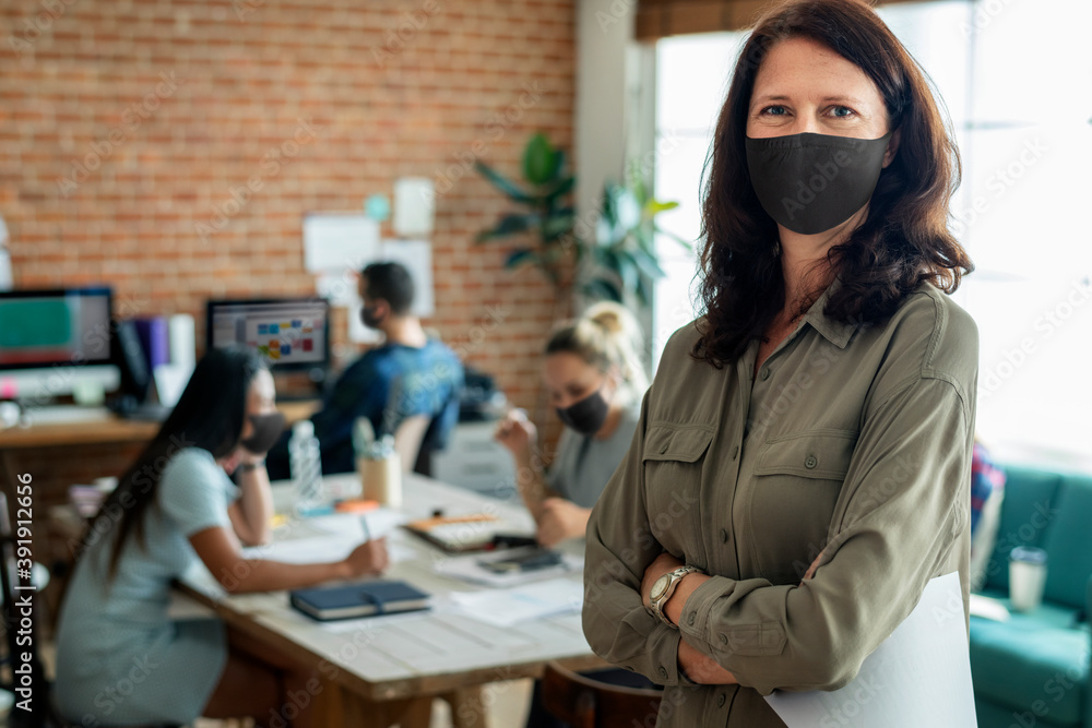 Businesswoman in face mask at the office Businesswoman in face mask at the office