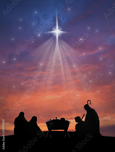 Christmas nativity scene of baby Jesus in the manger with Joseph, Mary, shepherd and sheeps