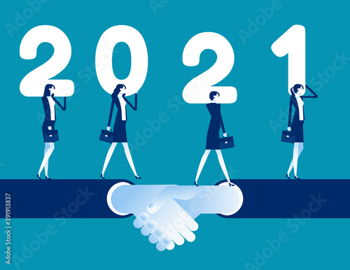 Business team walk together on shaking hand and hold number 2021