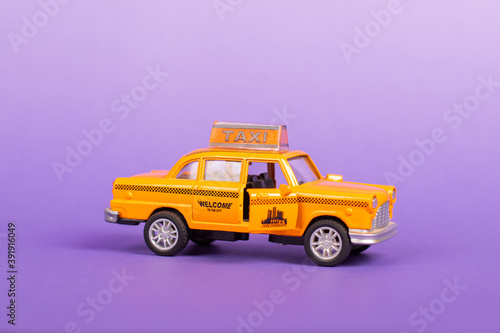Taxi Toy with open Doors Travel Discover on Purple Background