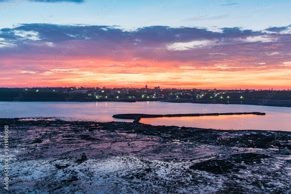 Amazing sunrise on Stone Weir in the intertidal zone of Chixi Village, Xiyu Township, Penghu, Taiwan Amazing sunrise on Stone Weir in the intertidal zone of Chixi Village, Xiyu Township, Penghu, Taiwan