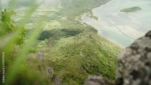 A top view from le morne on the Mauritian coastline. Grass is softly visible in the foreground. photo