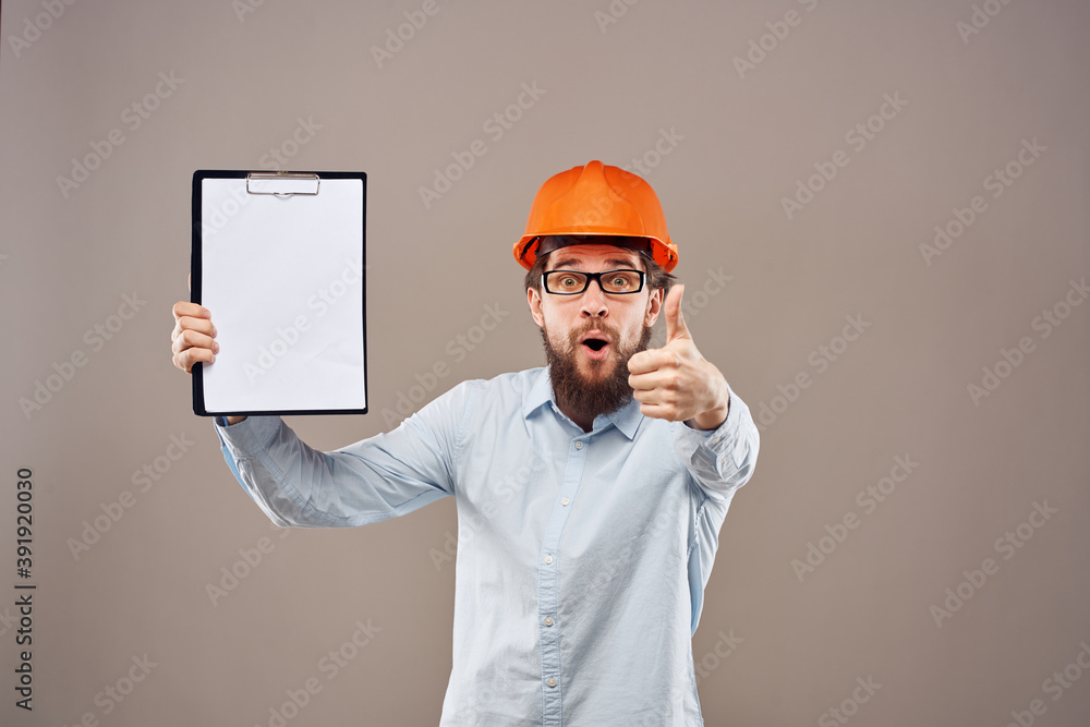 Worker man orange hard hat construction industry manual Worker man orange hard hat construction industry manual