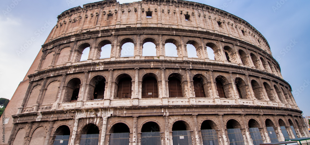 The Colosseum and the homonymous square on a summer day, Rome, Italy