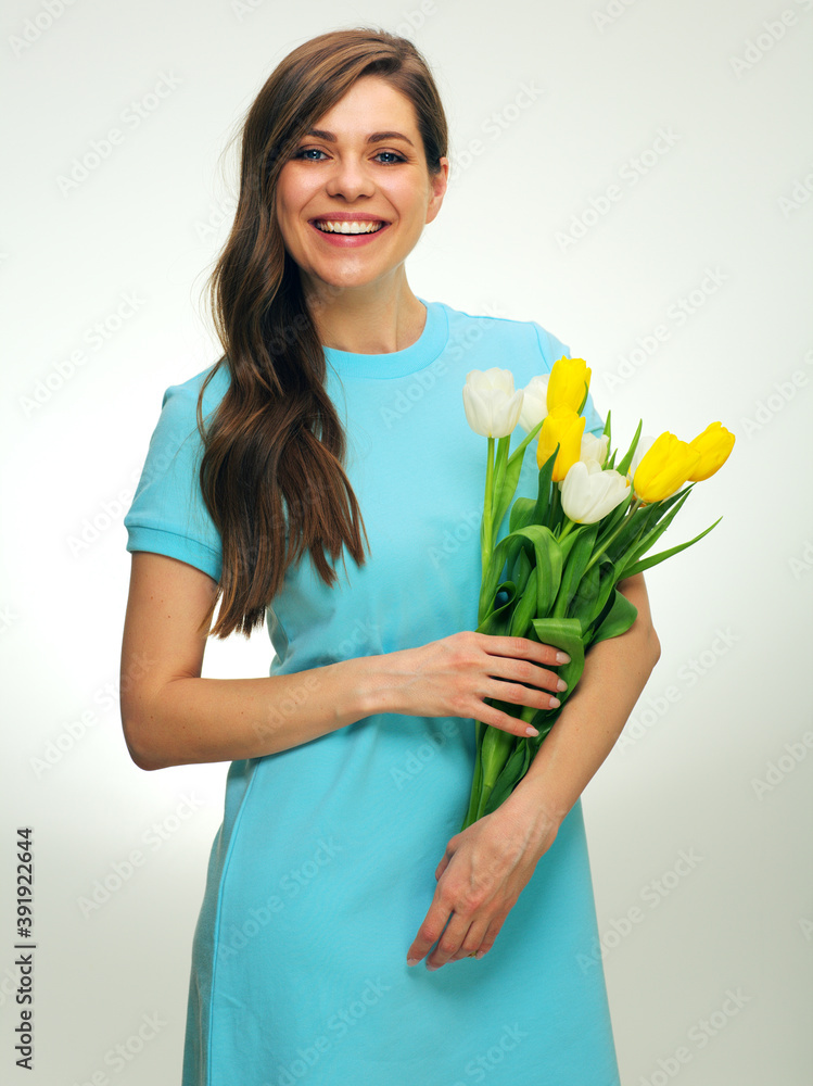 Happy woman with big toothy smile holding tulip flowers. Happy woman with big toothy smile holding tulip flowers.
