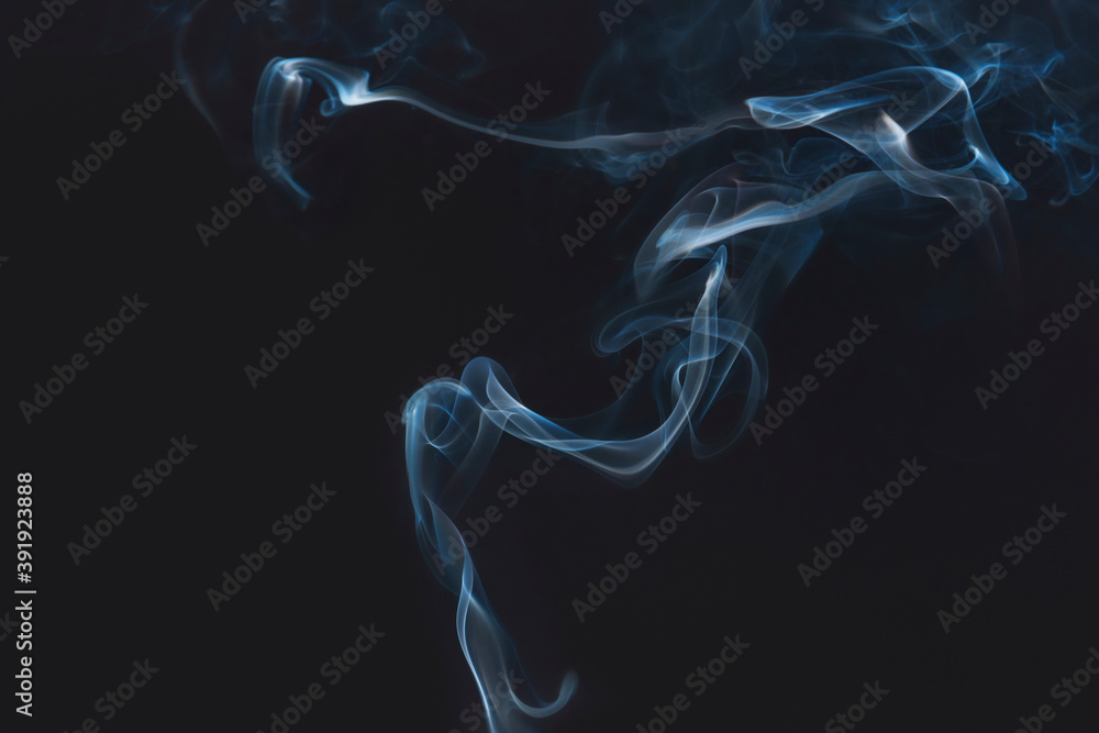 Fototapeta premium Blue smoke on dark background wallpaper