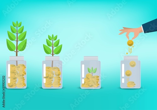 Saving  money. A hand putting coins in bottle on blue background. The coins in the bottle for save money.investment,bank,finance,Photo financial saving and Saving . 