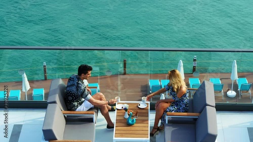 couple is drinking coffee on the terrace of the sea hotel.