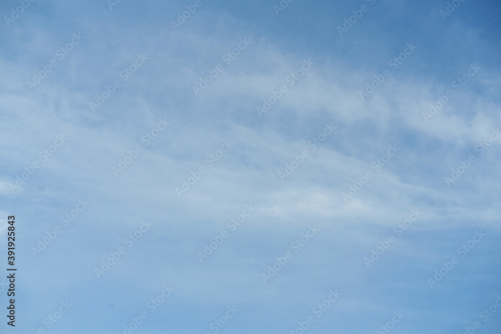 Sky with white clouds pattern background. Sky and clouds in daylight. Outdoor natural background.