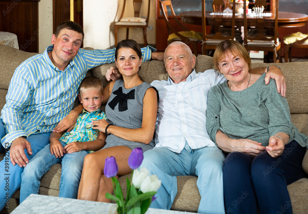 Portrait of happy family with grandparents together at home