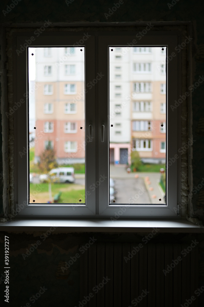Photo of a finished new double-leaf window in a city apartment Photo of a finished new double-leaf window in a city apartment