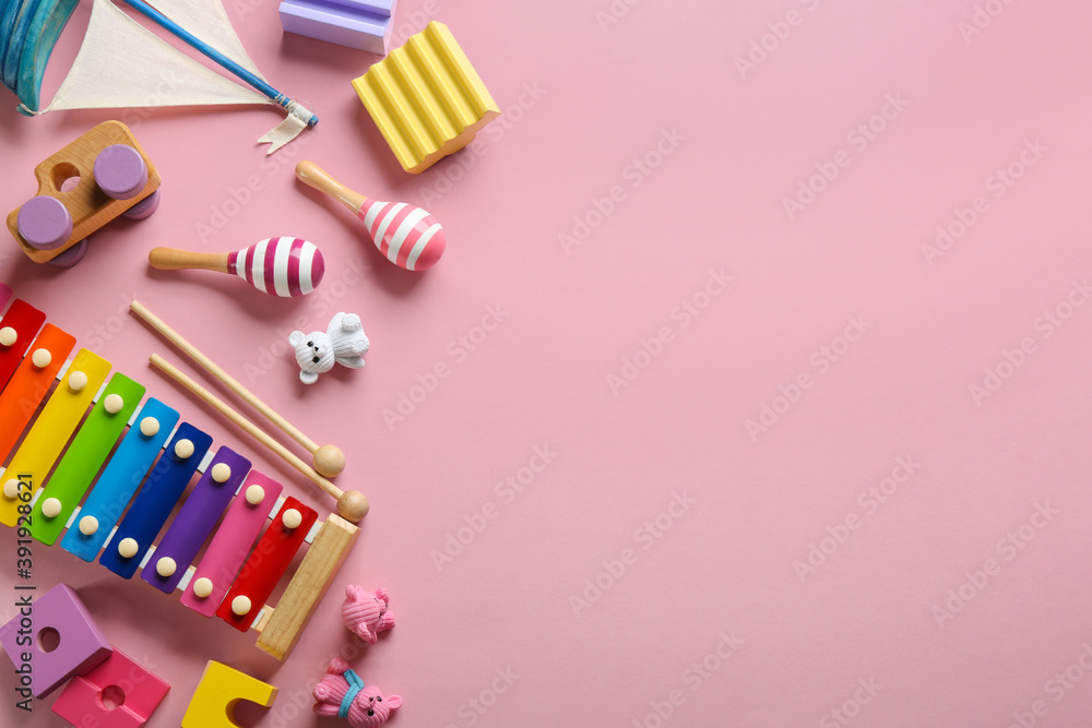 Flat lay composition with different toys on pink background. Space for text Flat lay composition with different toys on pink background. Space for text