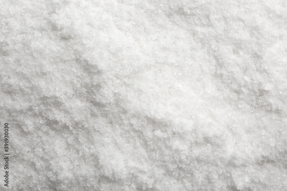 Natural white salt as background, top view Natural white salt as background, top view