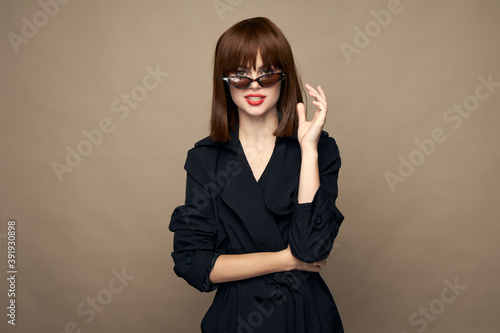 Wallpaper Mural Elegant brunette fashionable clothes self-confidence laughing on a beige background Torontodigital.ca