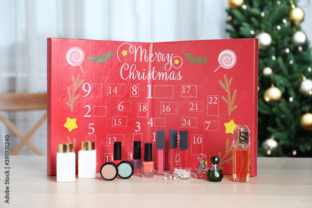 Christmas advent calendar with perfumes, skin care and decorative cosmetics  on table Stock Photo | Adobe Stock