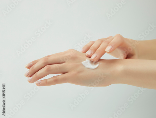 hands applying cream on their hands