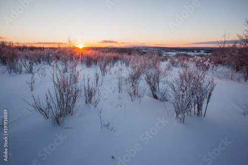 Sunrise scenery in the wasteland snow.