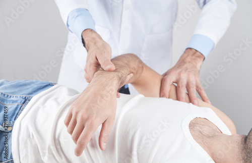 Caucasian doctor massaging patient hand. © andranik123
