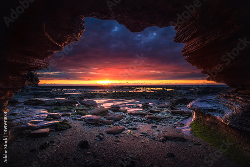 Watch the sunrise in the cave photo
