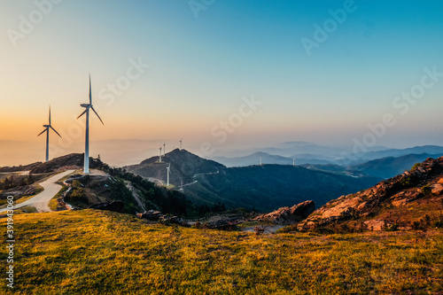 Wind power windmill on top of the mountain photo