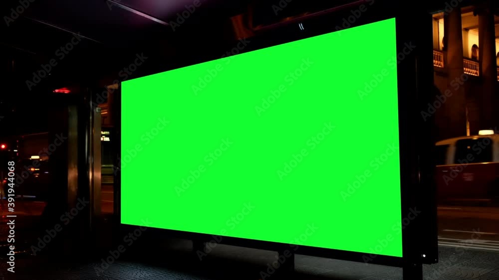Night city street billboard stand with green screen. Green screen for text or copy. Night city street billboard stand with green screen. Green screen for text or copy.