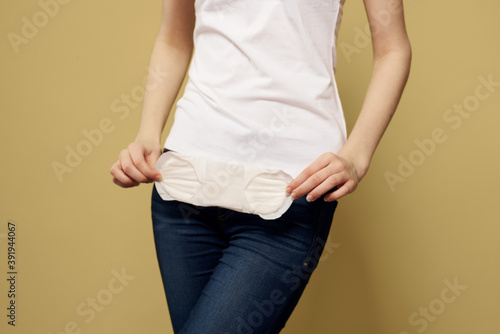 girl in jeans with a pad in hand hygiene clean appearance
