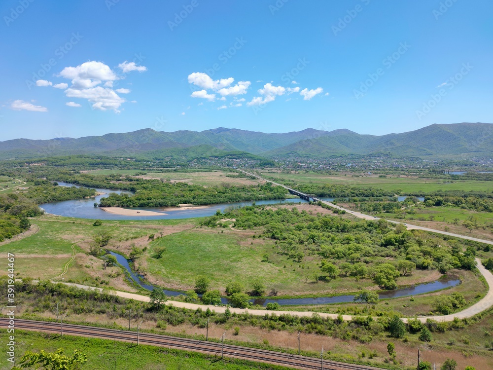 Landscape in rural areas overlooking the river and mountains.