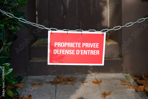 Private Property no entry Sign board panel in french means propriete privee defense d'entree photo