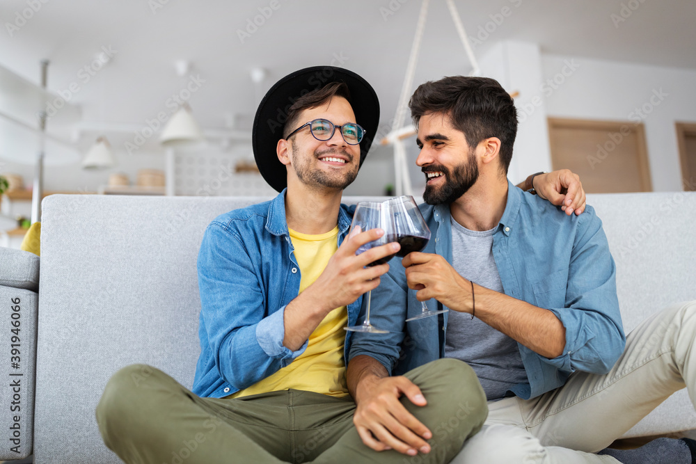 Happy gay couple embraced, joking and having fun in an intimate hug Happy gay couple embraced, joking and having fun in an intimate hug