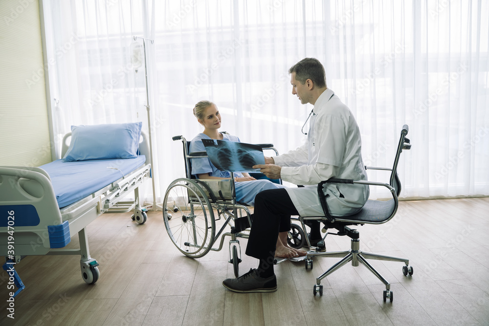 Doctor show and discussing with patient about x-ray film and medical treatments in examination room at hospital,Medical healthcare job, or hospital business concept. Doctor show and discussing with patient about x-ray film and medical treatments in examination room at hospital,Medical healthcare job, or hospital business concept.