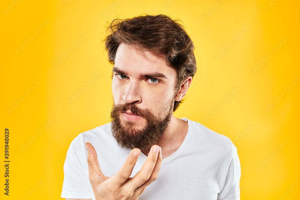 bearded man gesturing with hands studio lifestyle discontent yellow background bearded man gesturing with hands studio lifestyle discontent yellow background