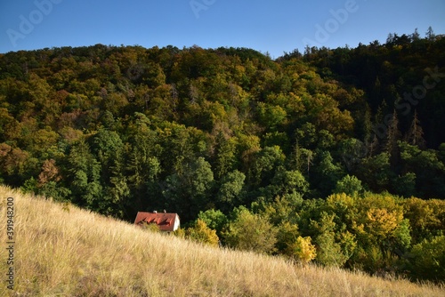 Sunny walk through Radotin Valley, a nature reserve in Czech Karst near Prague, Czech Republic. Water mill called Taslaruv Mlyn is part of this trail. photo