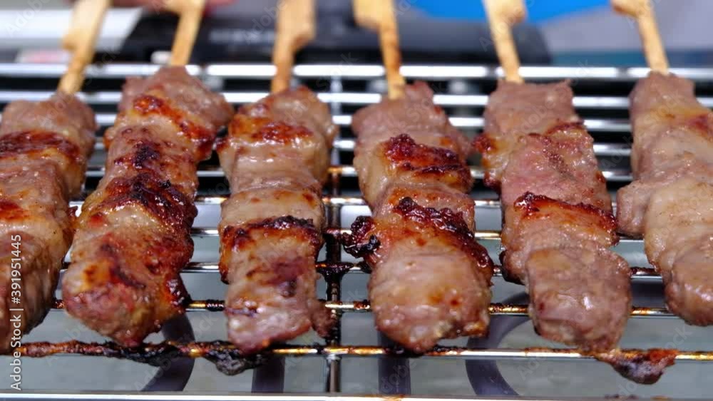 Closed-up in front Grilled meat on the grill, Thailand and Asian street food. Closed-up in front Grilled meat on the grill, Thailand and Asian street food.